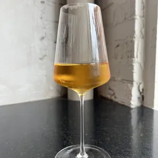a glass of wine on a table