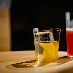 a glass of orange juice and a glass of orange juice