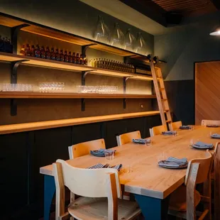 a long wooden table and chairs