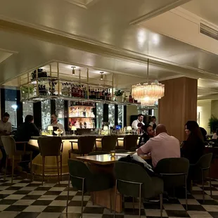 The bar area with soft lighting and comfortable chairs