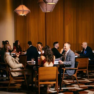 a group of people sitting at a table