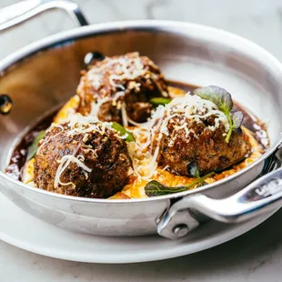 three meatballs in sauce