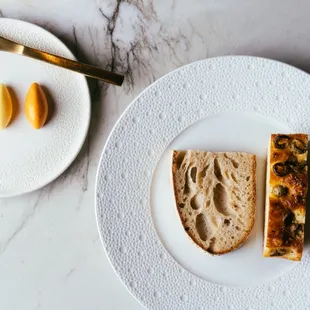 a plate of bread and a plate of macaroni
