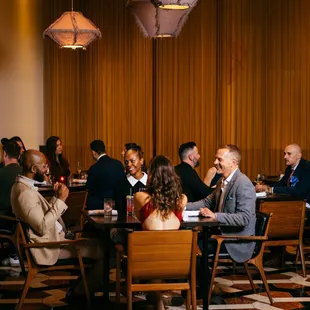 a group of people sitting at a table
