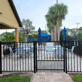 Find the Doggie Dining Section entrance by walking to the right of the front Clubhouse entrance (around the corner).