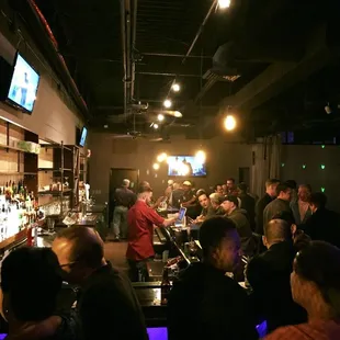 a large group of people at a bar