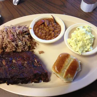 Pork combo. Ribs pulled pork baked beans potato salad