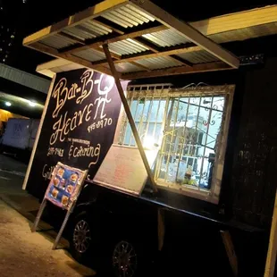 ows a food truck parked in front of a building