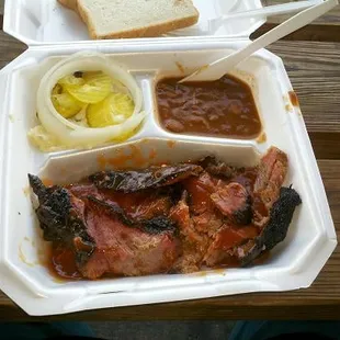This is a 1-meat plate with fatty brisket and some burnt ends. That's potato salad under the pickles and 2 pieces of bread. $6!