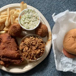 Bbq and fried chicken with fries, slaw, roll, hush puppies and burger. Service is very hit or miss; either quick or they ignore you.