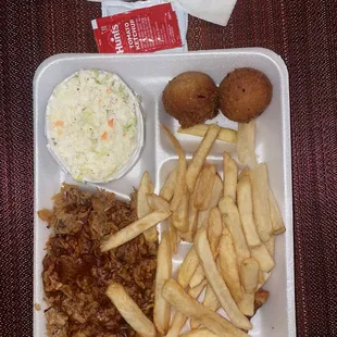 BBQ plate with pulled pork, Cole slaw, hush puppies and fries
