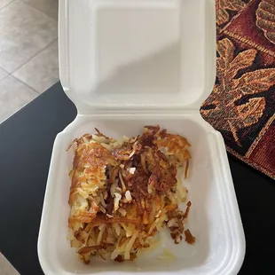 an open takeout container of food