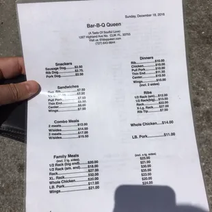 ows a person holding a menu