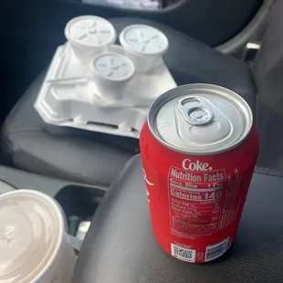 ows a drink and a tray of food