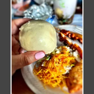 ows a person holding a ball of food