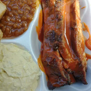 Pork Ribs Dinner with baked beans and potato salad.
