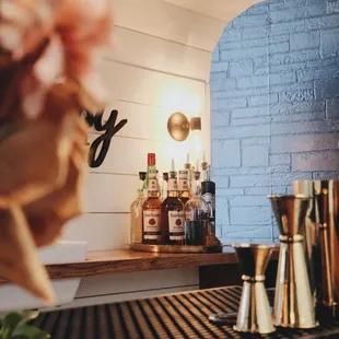 a bar counter with a vase of flowers