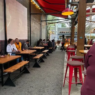 people sitting at tables in a restaurant