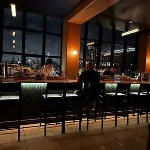 people sitting at the bar