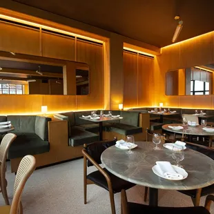 a dining area with tables and chairs