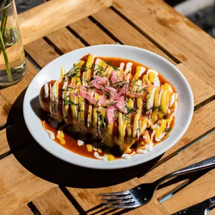 a plate of food on a wooden table