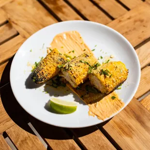 a plate of food on a wooden table