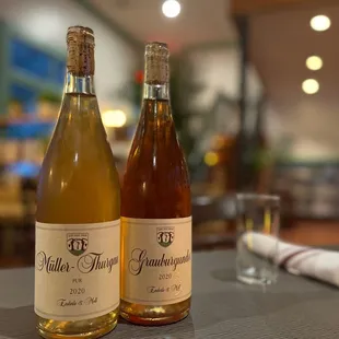 two bottles of wine on a table