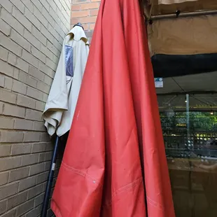 Unused umbrellas across frim pur table