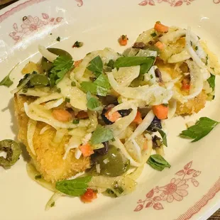 Muffuletta croquette topped with a fennel and olive salad. Fresh and delicious.