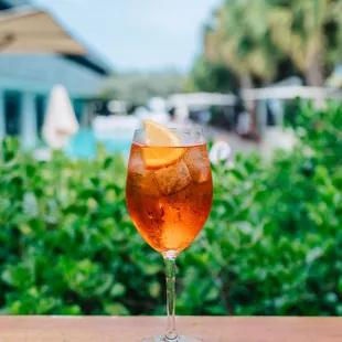 a drink in a glass on a table