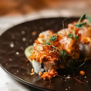 a plate of sushi on a table