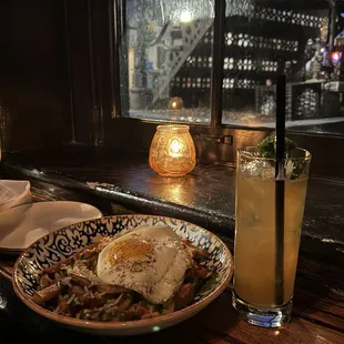 a plate of food and a drink on a table