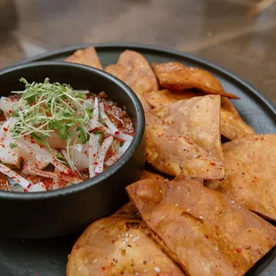 a bowl of salsa and tortilla chips