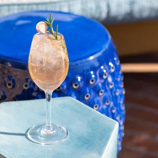 a glass of wine on a table