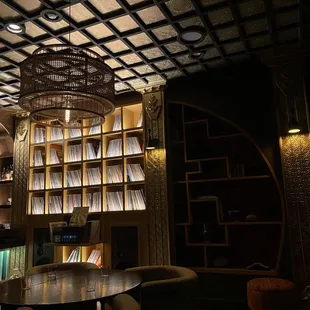 a table and chairs in a dimly lit room