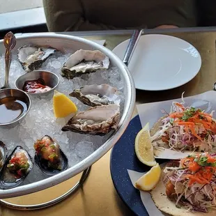 Herb and jalapeño marinated mussels, oysters, crispy cod tacos