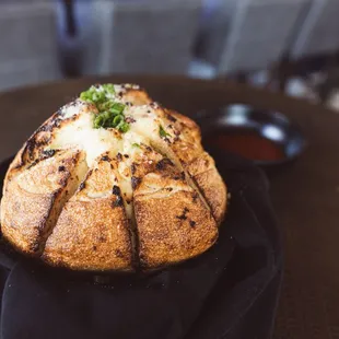 a baked bread with cheese and herbs