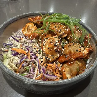 Popcorn Gyoza - Mini fried pork gyoza tossed in spicy miso sauce, cabbage slaw, scallions, sesame seeds (Yum!)