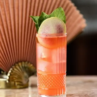 a cocktail in a tall glass
