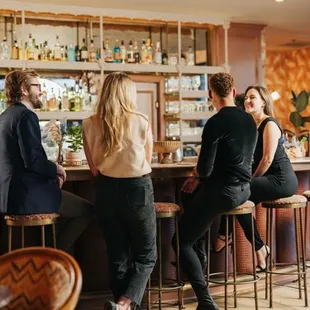 people sitting at a bar