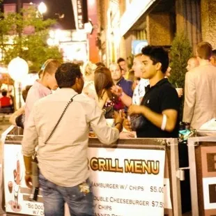 a crowd of people at a bar
