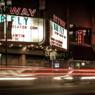 a blurry image of a street at night