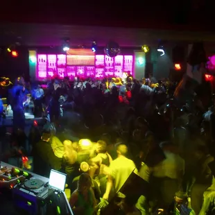 a crowd of people dancing at a party