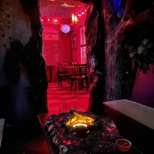 a fire pit in the middle of the room