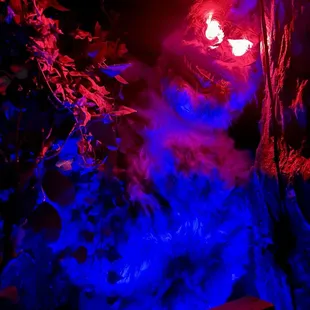 blue and red lights in a cave