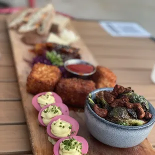 Hygge board. Deviled eggs. Crispy Brussels. Mac and cheese bites.