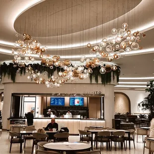 Tables and chairs to sit in front of Bar Ito