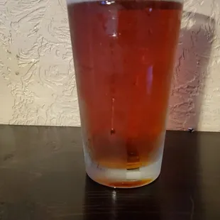 a glass of beer on a table
