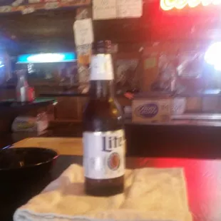 a bottle of beer on a table