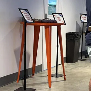 a man standing in front of a table